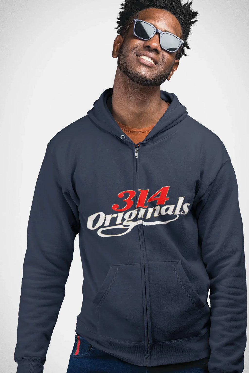 Man wearing navy 314 Originals zip-up hoodie with red and white logo, styled with sunglasses for streetwear look